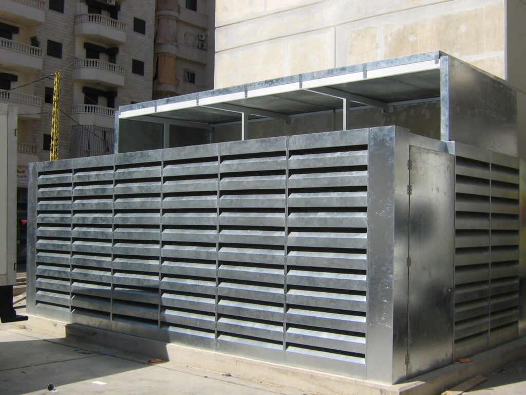 Acoustic louver covering outdoor HVAC equipment for noise reduction.