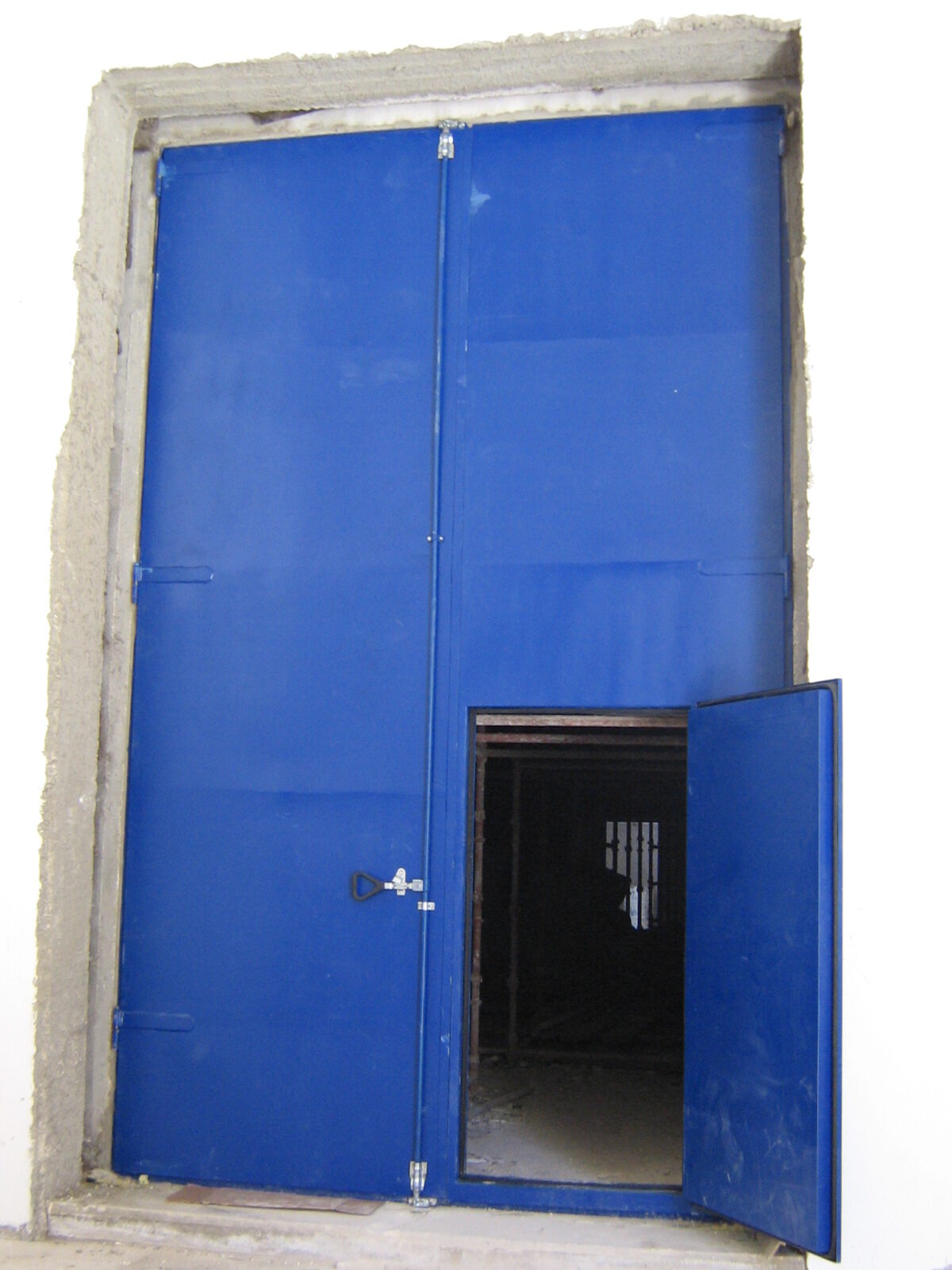 Acoustic door installed at the entrance of a generator room for noise control.