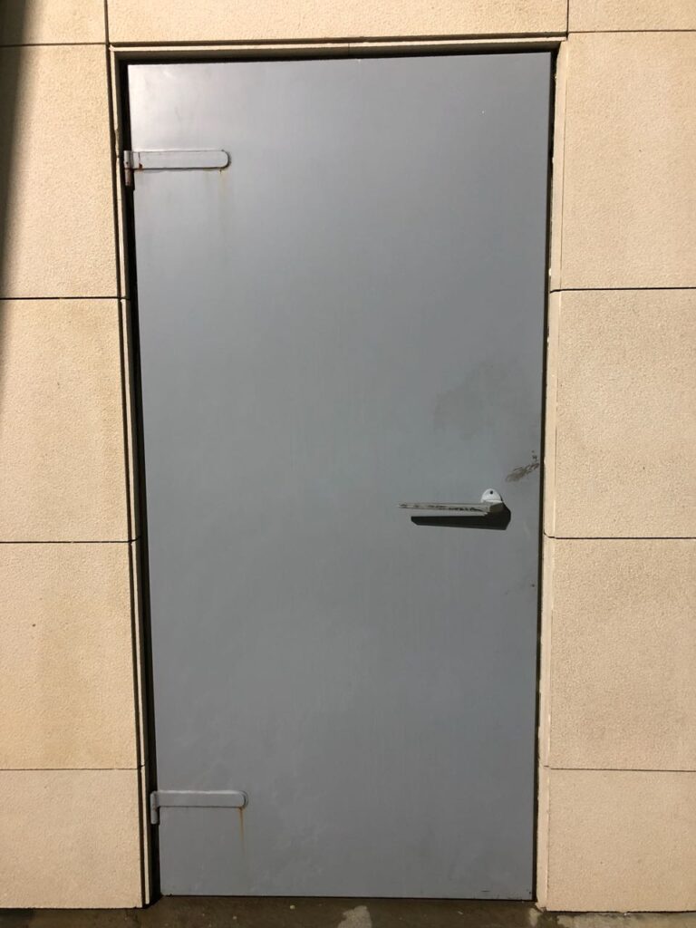 Interior view of an acoustic door inside a generator room.