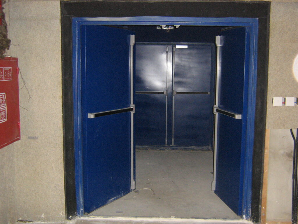 Double-leaf acoustic door for generator room access.