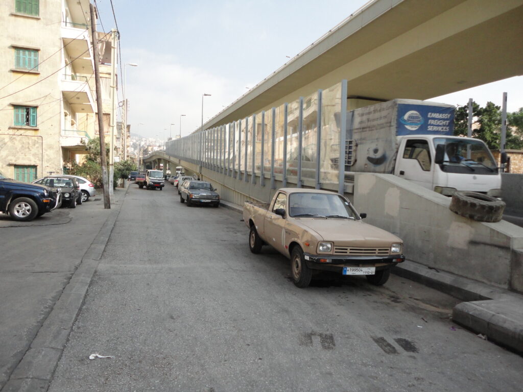 Acoustic sound barrier installed in an urban infrastructure project to control traffic or equipment noise.