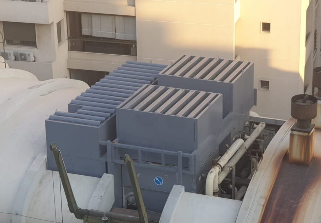 Acoustic enclosure for mechanical equipment installed on a university rooftop in Lebanon.