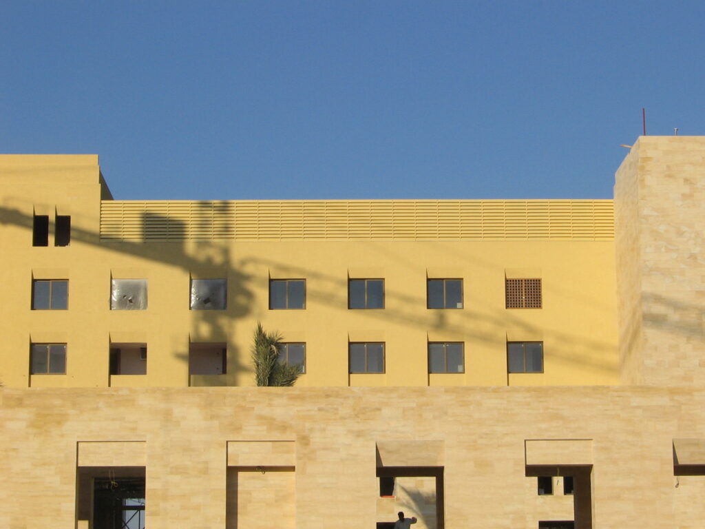 Wide rooftop view of acoustic louvres enclosing chillers at Kempinski Hotel, Aqaba.