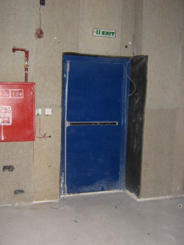 Acoustic door with integrated ventilation louvers for generator room.