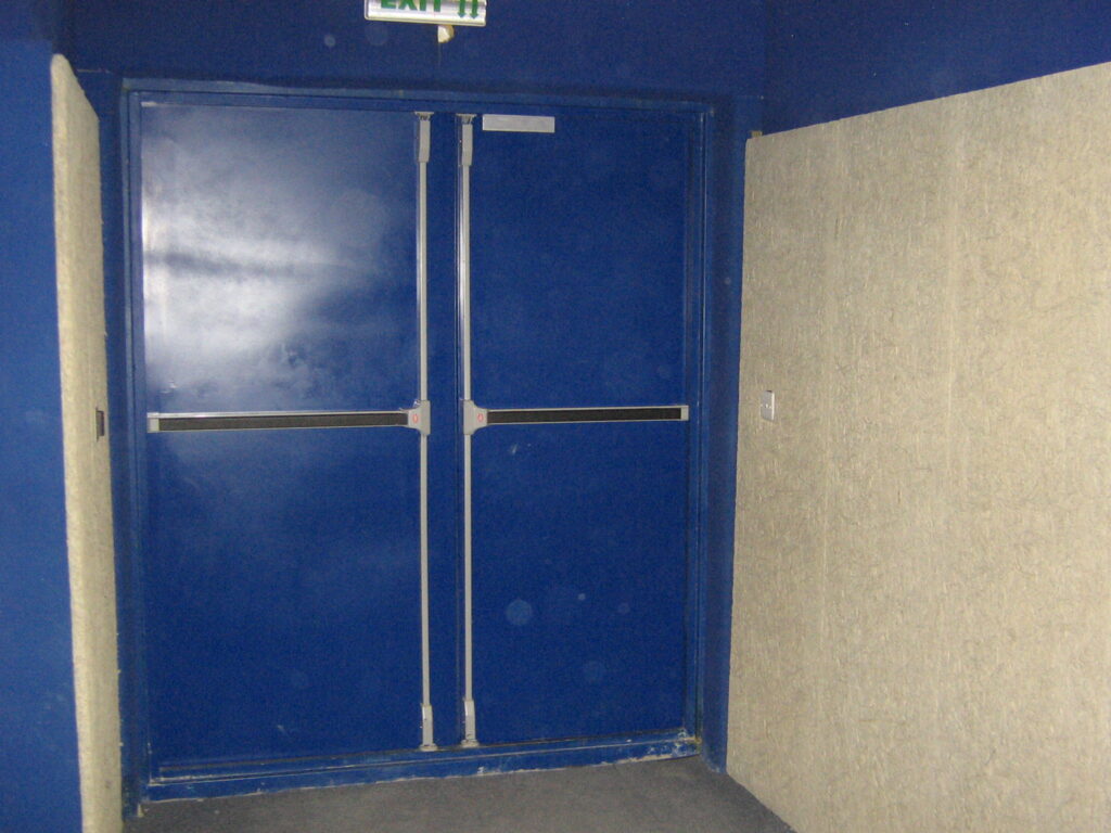 Industrial acoustic door installed in a large generator facility.