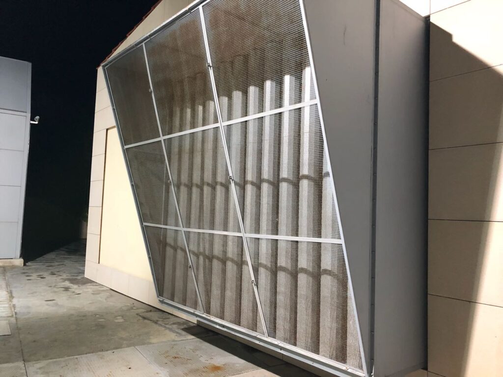 Sound attenuator installed at the inlet of a generator room for noise reduction.
