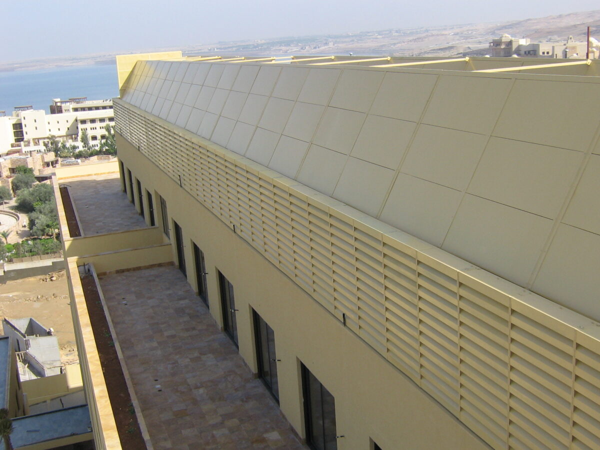 Acoustic panels installed around rooftop chillers to reduce noise impact.