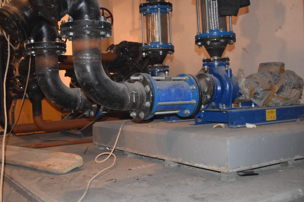 Acoustic floating pad installed under pump to isolate vibrations.