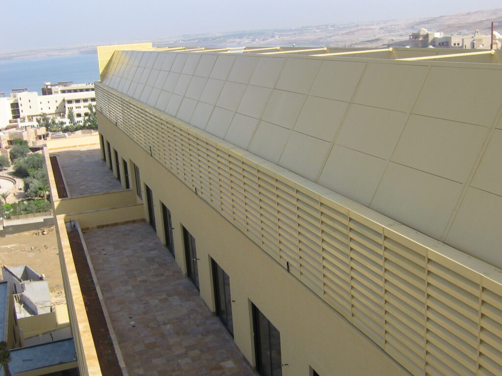 Acoustic louvers and panels combined to reduce rooftop HVAC noise.