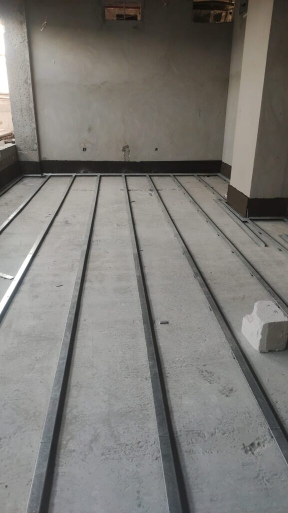 Floating floor installation applied under technical floor for vibration and noise control.