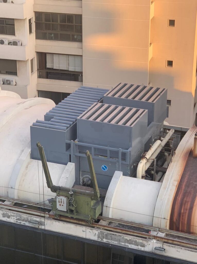 Acoustic enclosure installed on a university rooftop to reduce HVAC noise.