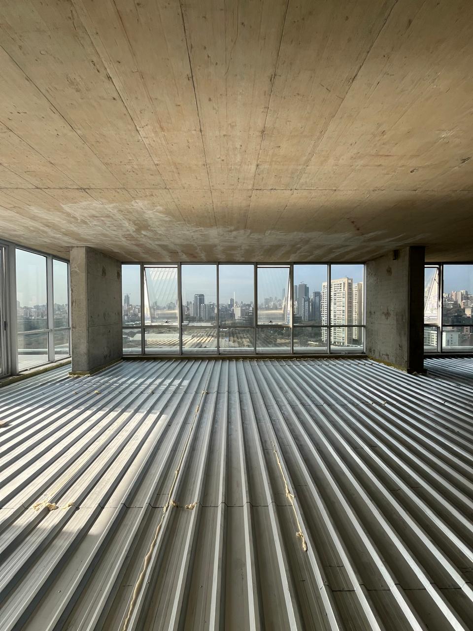 Floating floor system being installed in a gym above offices in Sin El Fil, Lebanon
